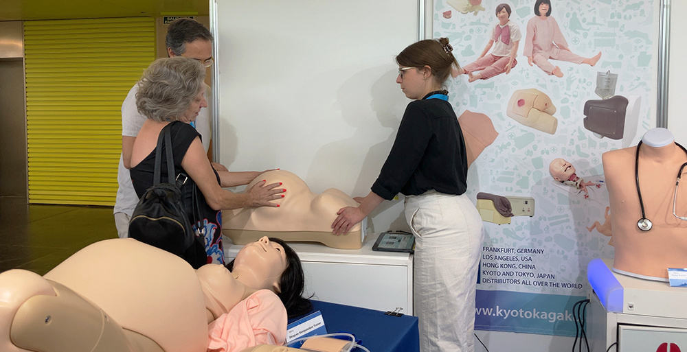 A visitor touching Obstetric Examination Simulator